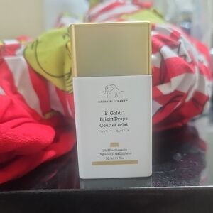 Drunk Elephant B-Goldi Bright Drops with White and Gold Design